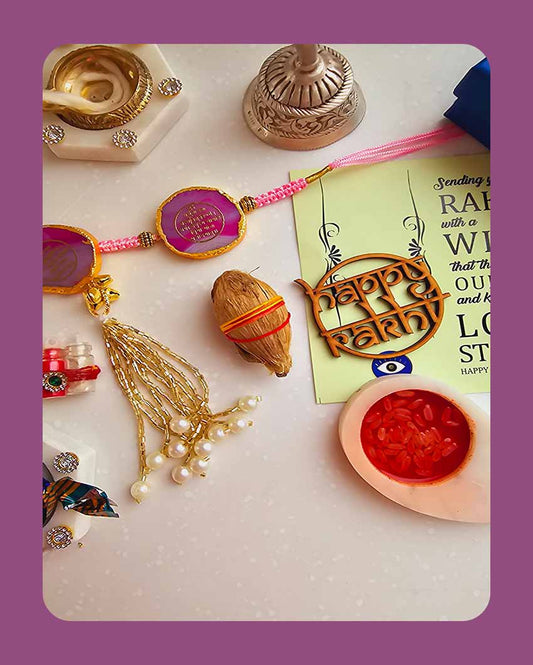 Pink Gayatri Mantra Couple Rakhi With Roli Chawal And Lotus Platter With Diya For Raksha Bandhan