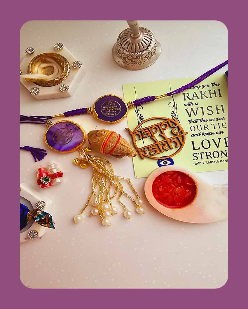 Purple Gayatri Mantra Couple Rakhi With Roli Chawal And Lotus Platter With Diya For Raksha Bandhan