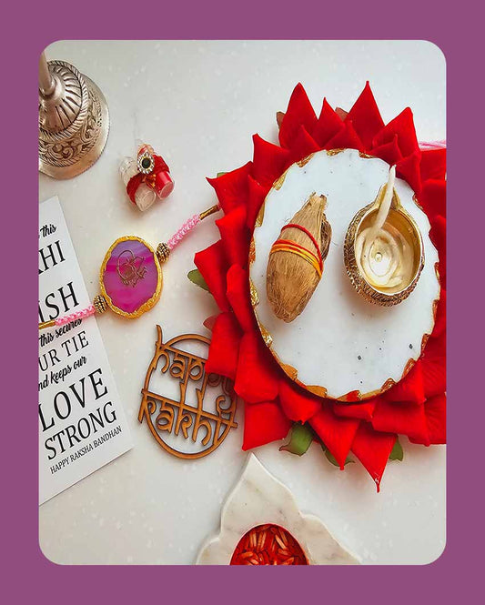 Pink Guru Ji Rakhi With Roli Chawal And Lotus Platter With Diya For Raksha Bandhan