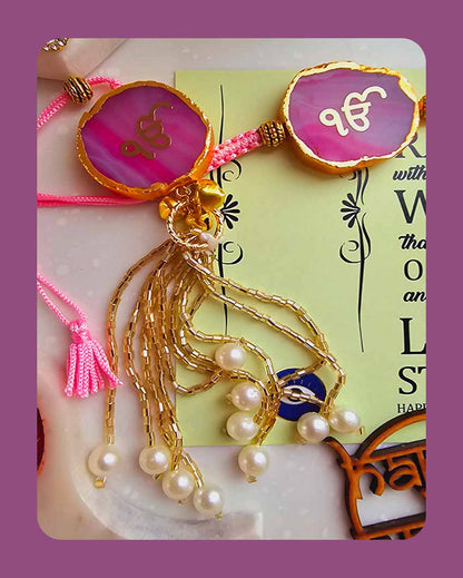 Pink Ik Onkar Couple Rakhi With Roli Chawal And Lotus Platter With Diya For Raksha Bandhan