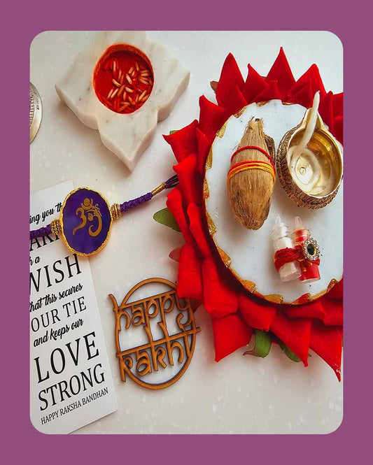 Purple Om Ganesha Rakhi With Roli Chawal And Lotus Platter With Diya For Raksha Bandhan