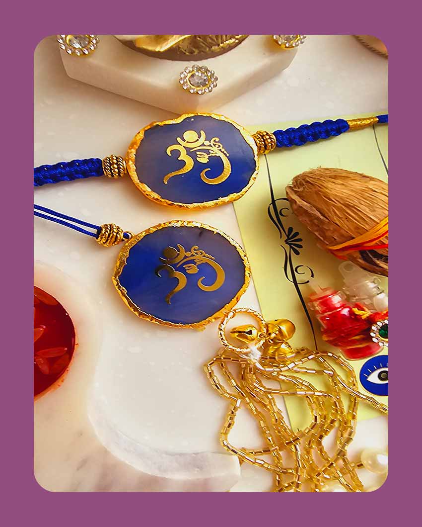 Blue Om Ganesha Couple Rakhi With Roli Chawal And Lotus Platter With Diya For Raksha Bandhan