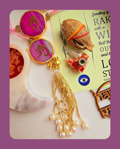 Pink Om Ganesha Couple Rakhi With Roli Chawal And Lotus Platter With Diya For Raksha Bandhan