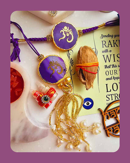 Purple Om Ganesha Couple Rakhi With Roli Chawal And Lotus Platter With Diya For Raksha Bandhan