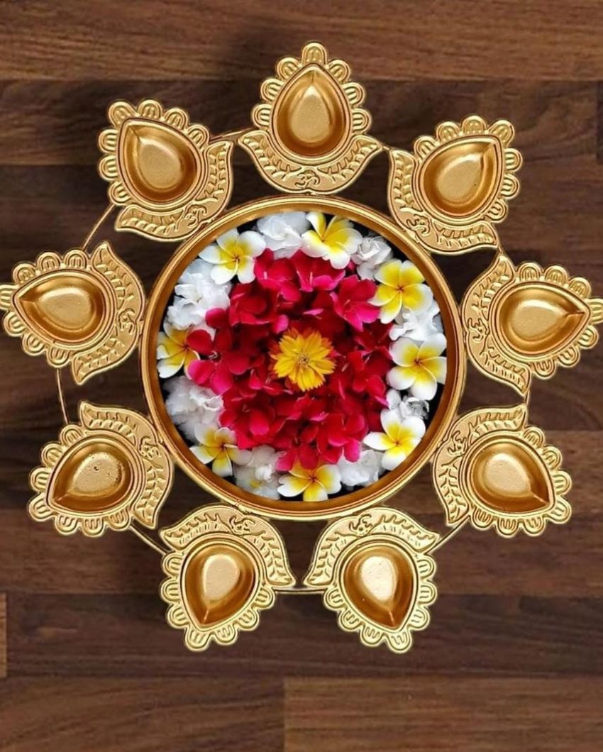 Golden Iron Urli with attached diyas