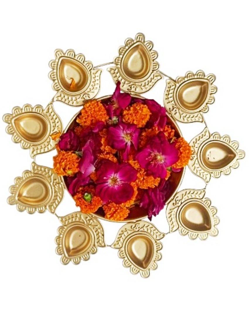 Golden Iron Urli with attached diyas