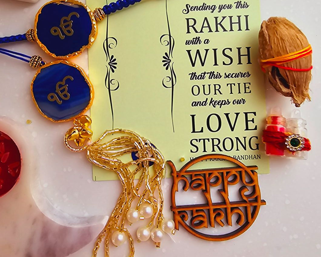 Blue Ik Onkar Couple Rakhi With Roli Chawal And Lotus Platter With Diya For Raksha Bandhan